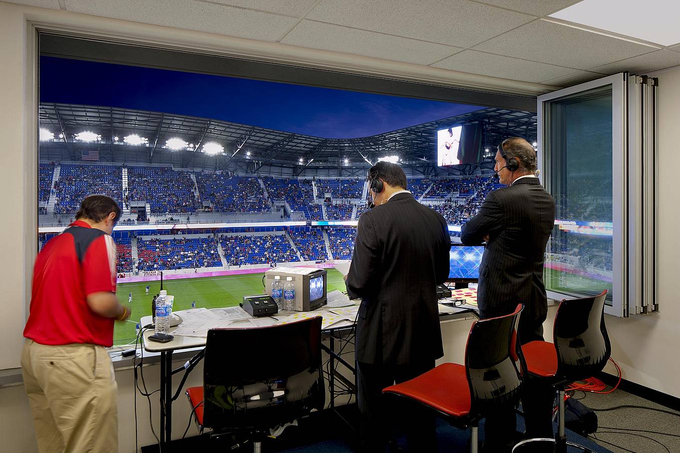 Commercial Sliding Glass Walls at NY Red Bulls stadium press box - Opened Interior Night View