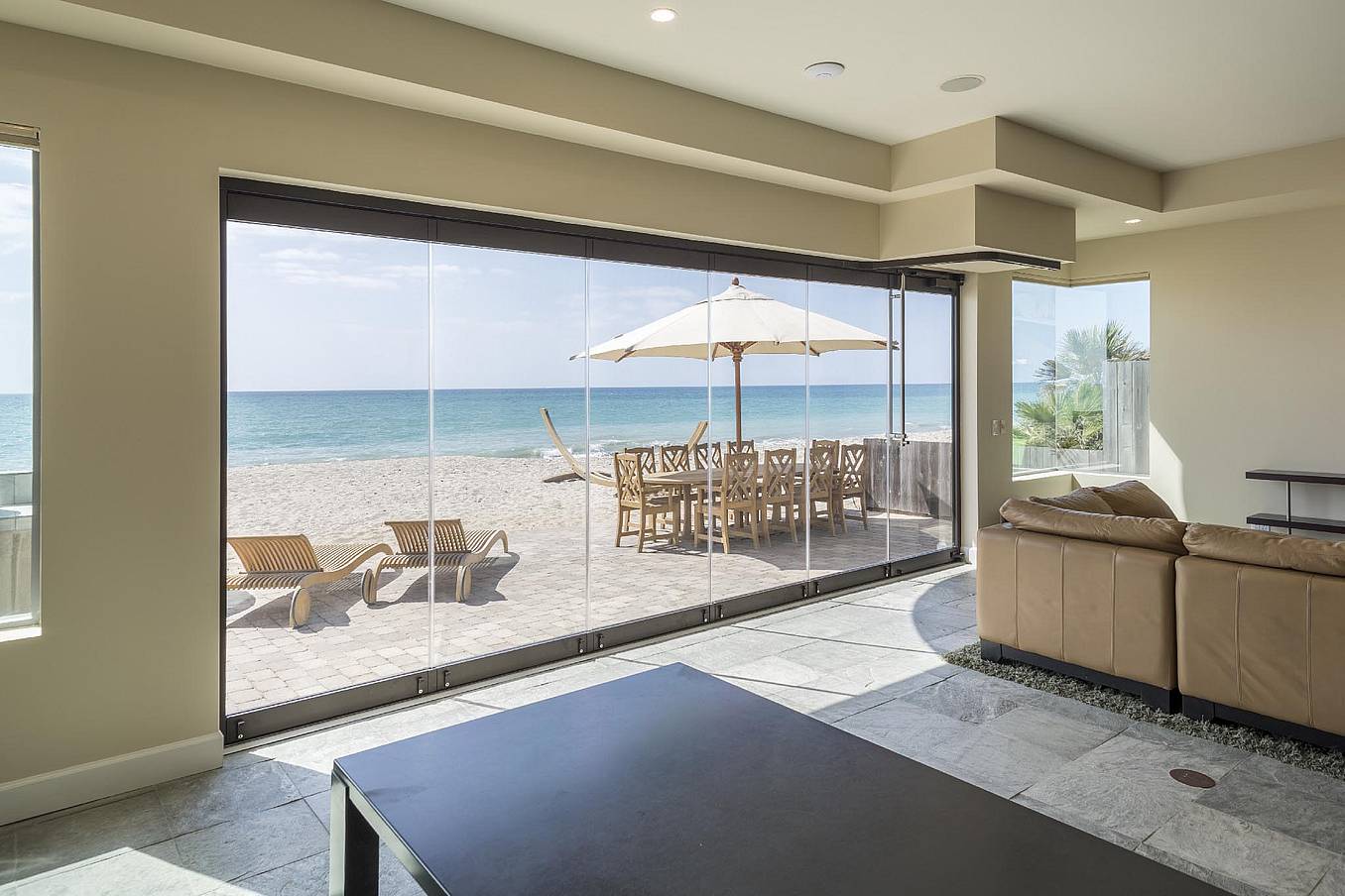 Energy-efficient accordion sliding glass doors in Dana Point, CA offer stunning views and enhance indoor-outdoor living