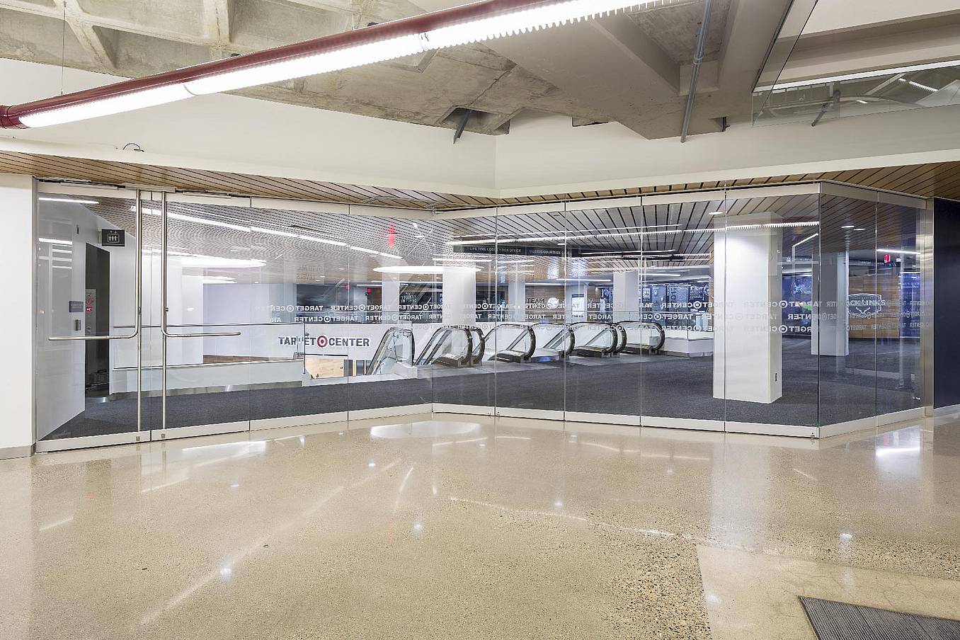 Target center with large frameless folding glass doors