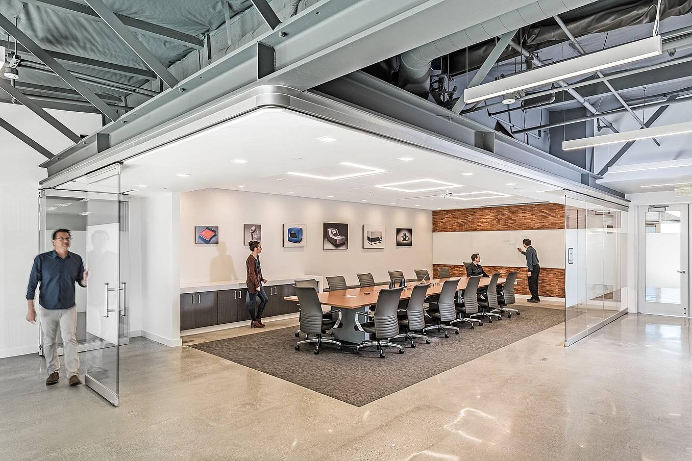 Office collaboration space with NanaWall HSW75 operable glass walls creating a flexible meeting space