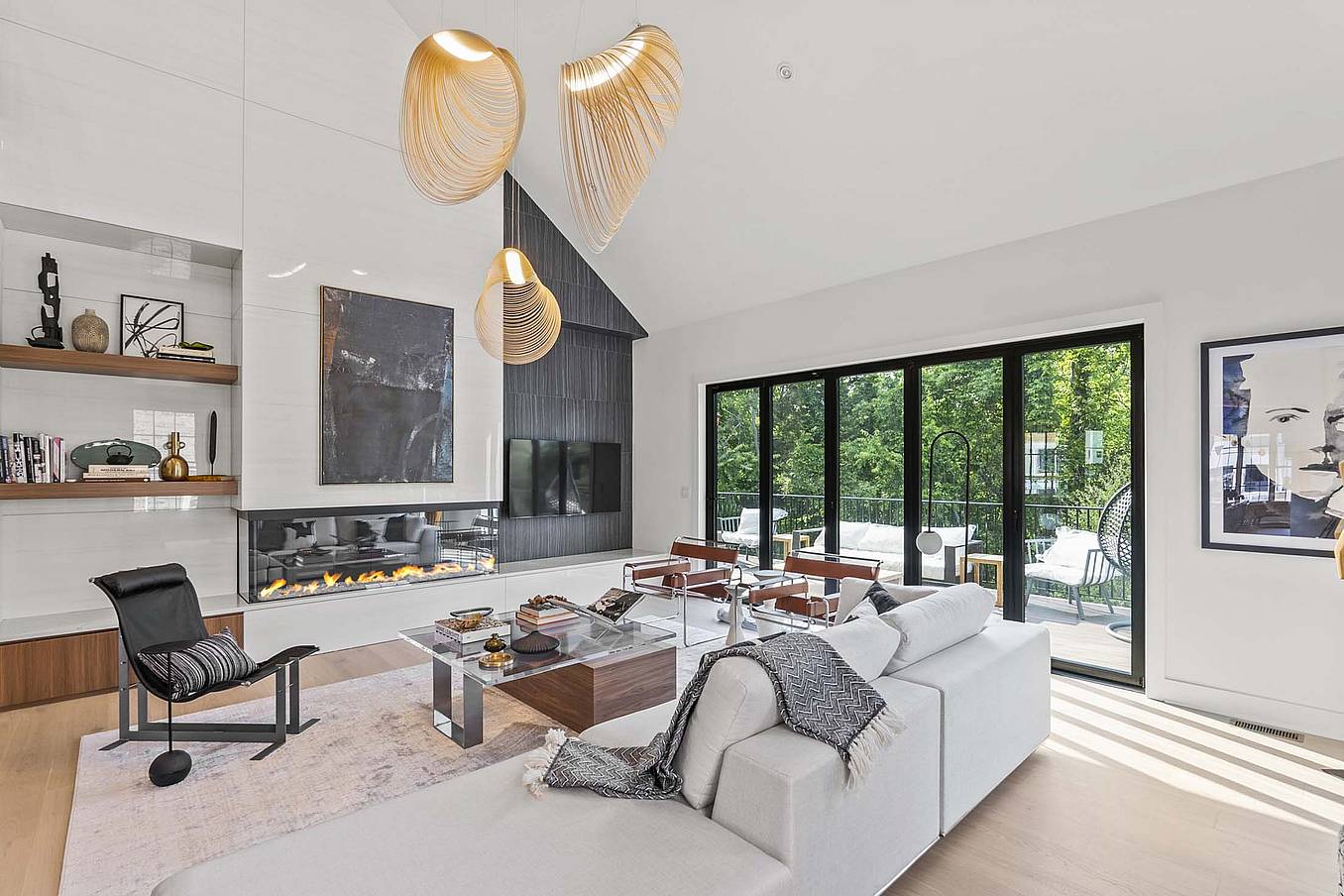 Accordion doors open to the patio, seamlessly blending indoor and outdoor spaces.
