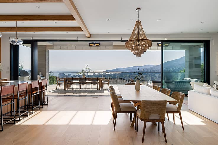 NanaWall sliding glass wall system in a West Vancouver residence, opening a kitchen to a scenic outdoor balcony