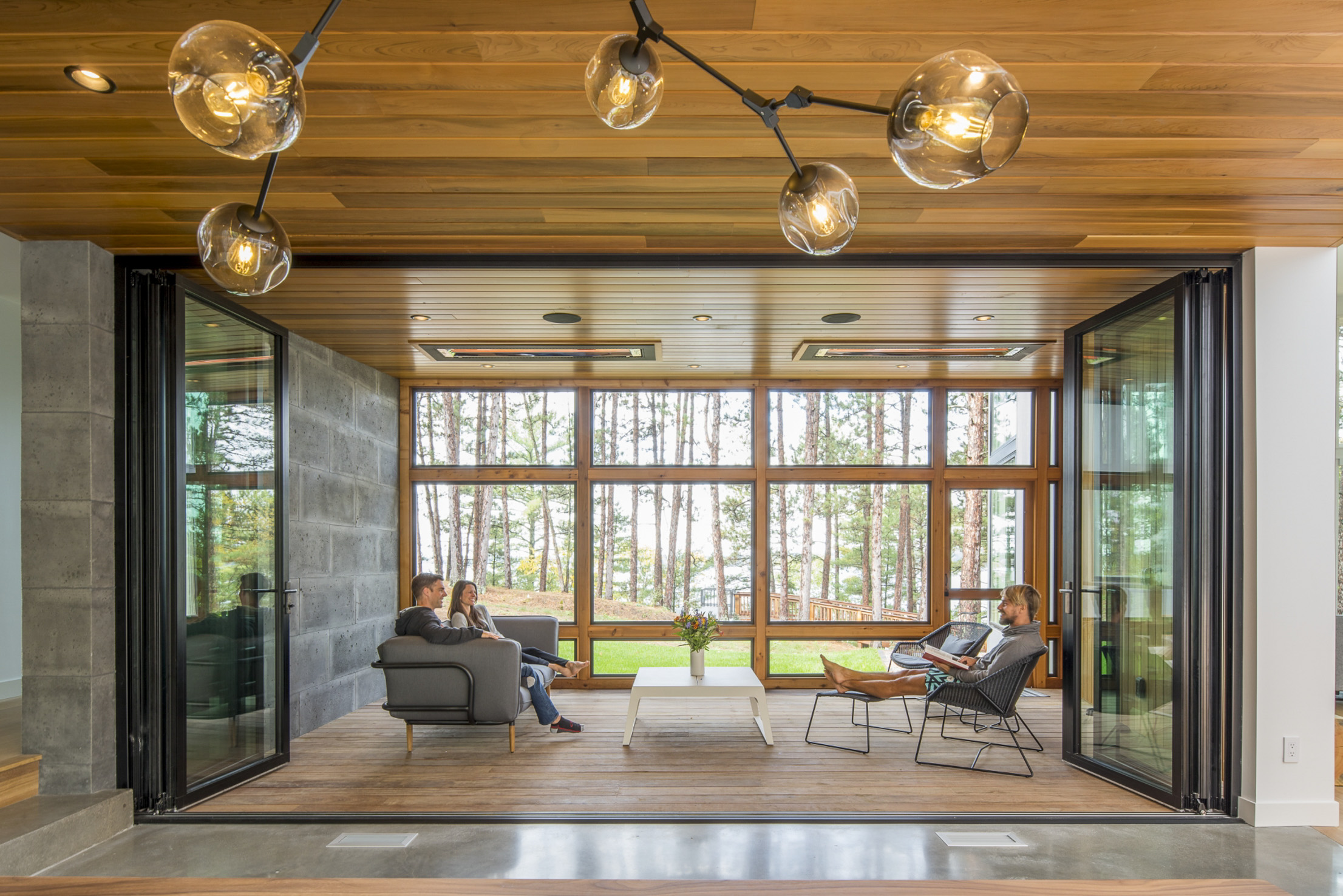Inviting Lakeside 3-Season Porch with Folding Glass Door System